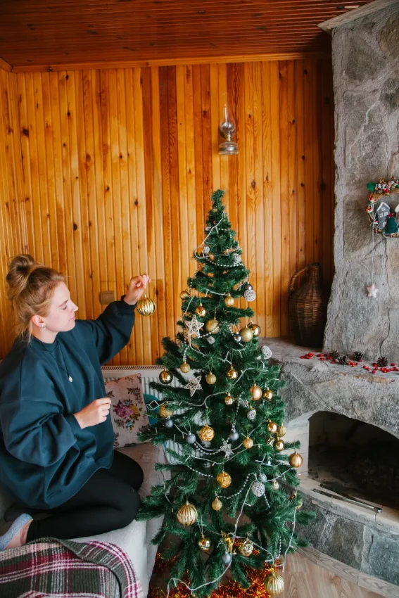 Swedish woman decorating Christmas tree