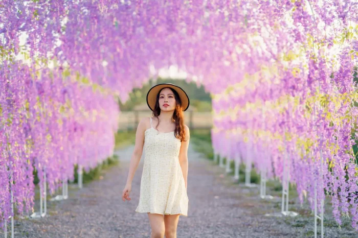 Asian girl in Kawachi Fuji Wisteria Garden