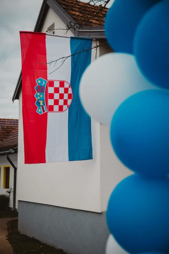 Croatian flag on traditional house