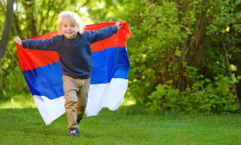 young Russian boy with Russian flag