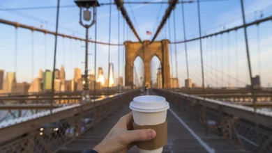 me drinking coffee in New York city on the bridge